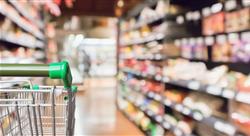 gorcery cart in grocery store with blurry background