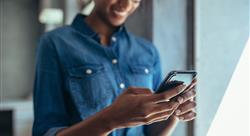 businessperson looking at her cell phone