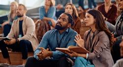 conference attendees discussing business on bleachers