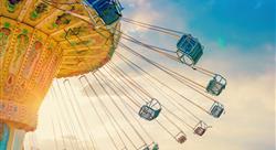 carousel ride spins fast in the air at sunset