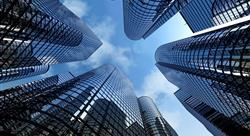 View looking up at the sky and reflective skyscrapers