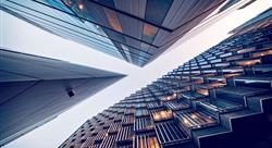 Looking directly up at the skyline of the financial district in central London