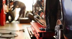 mechanic replacing tires on a car