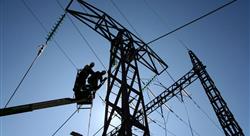 two utility workers on a lift working on power lines with blue sky behind them